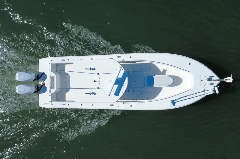 Slide: The Image of Aerial view of 2010 Yellowfin 32 Offshore boat cruising on water. - 11