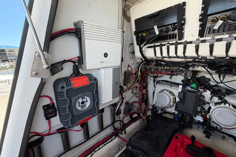 Slide: The Image of Electrical system inside a 2010 Yellowfin 32 Offshore boat, showcasing wiring and components. - 23