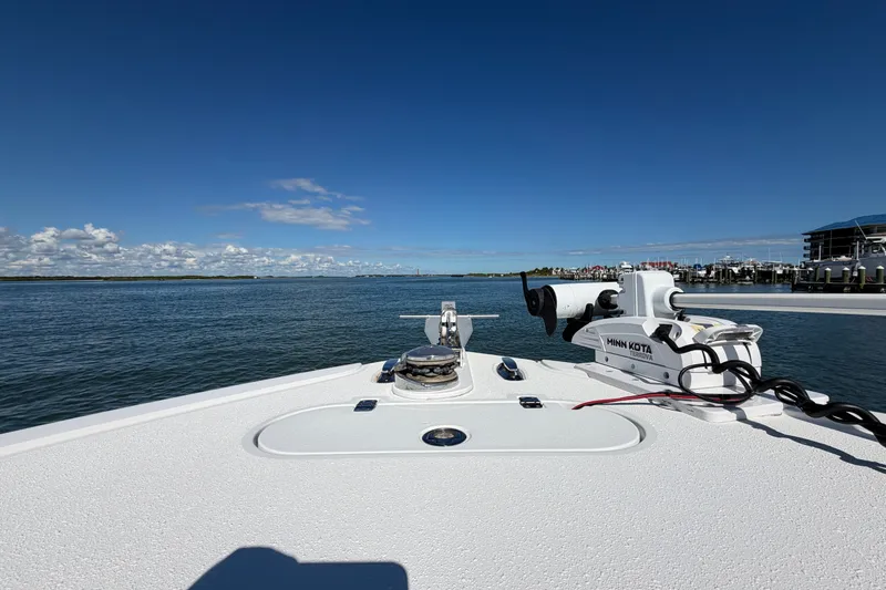 Slide: The Image of 2010 Yellowfin 32 Offshore boat on calm water with clear blue sky. - 18