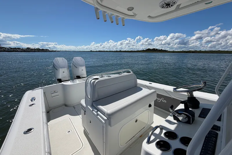 Slide: The Image of 2010 Yellowfin 32 Offshore boat with dual engines on a sunny day. - 38