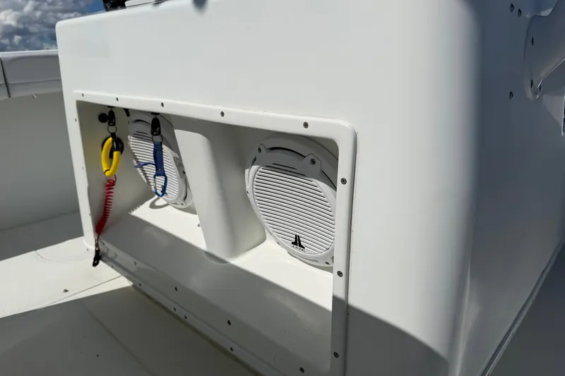 Slide: The Image of 2010 Yellowfin 32 Offshore boat speakers and safety lanyards on deck. - 39