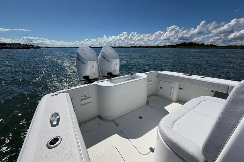 Slide: The Image of 2010 Yellowfin 32 Offshore boat with twin Mercury engines on a sunny day. - 25