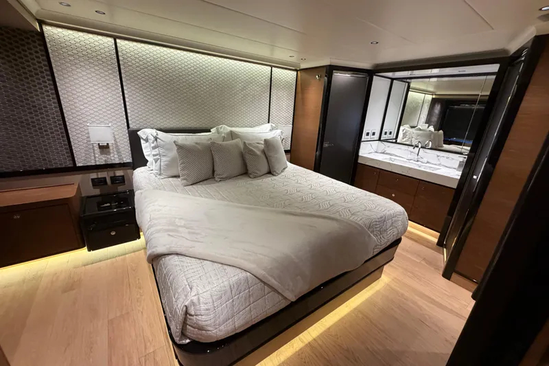 Slide: The Image of Luxurious bedroom interior of 2024 Absolute Navetta 75 yacht, featuring elegant design and ambient lighting. - 8