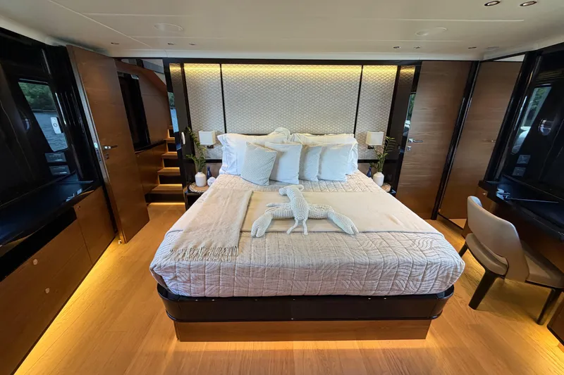 Slide: The Image of Luxurious bedroom interior of 2024 Absolute Navetta 75 yacht, featuring elegant decor and modern furnishings. - 11