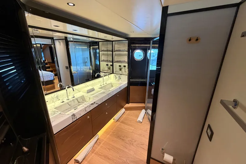 Slide: The Image of Luxurious bathroom interior of 2024 Absolute Navetta 75 yacht, featuring dual sinks and elegant design. - 10