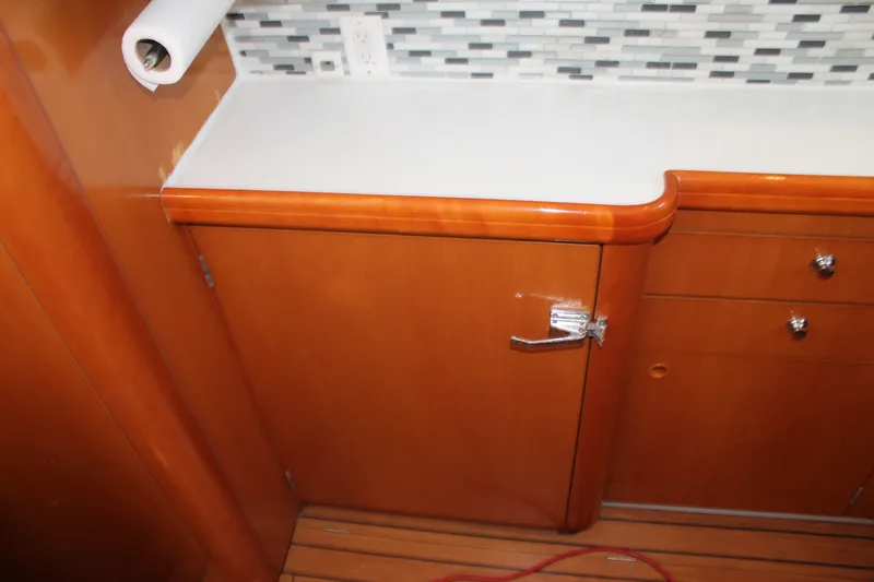 Slide: The Image of Wooden cabinet and countertop in 2004 Lagoon Power 43 yacht interior. - 34