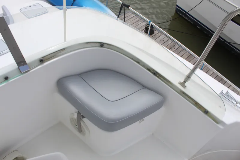 Slide: The Image of Cockpit seating on a 2004 Lagoon Power 43 yacht, featuring sleek design and comfortable cushions. - 15