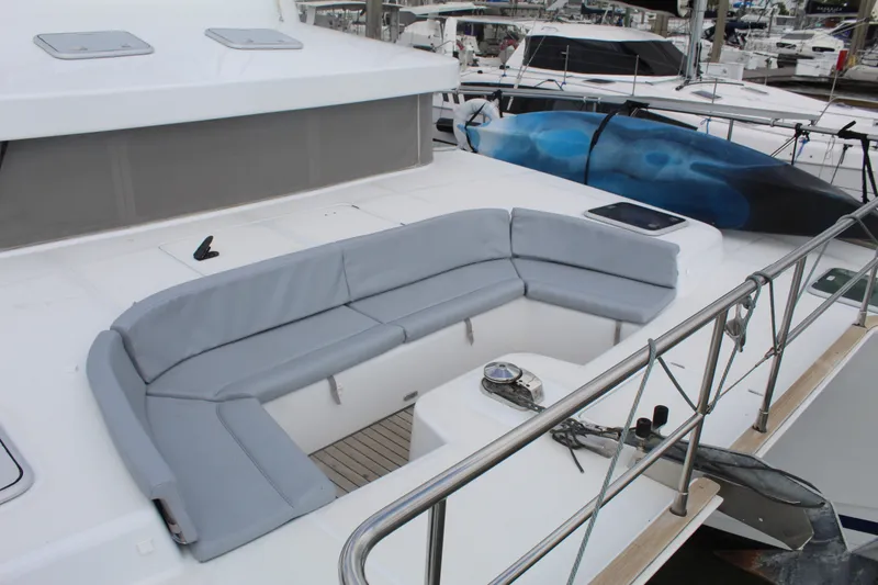 Slide: The Image of 2004 Lagoon Power 43 yacht with spacious deck seating and kayak storage. - 24