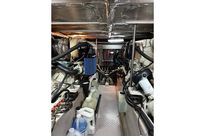 Slide: The Image of Engine room of a 2003 Sea Ray 480 Sedan Bridge yacht, showcasing machinery and equipment. - 5