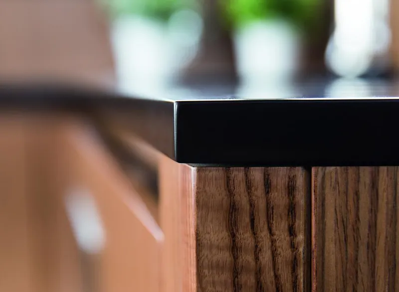 Slide: The Image of Close-up of a sleek wooden cabinet with a black countertop on a 2026 Sealine C430. - 21