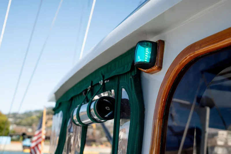 Slide: The Image of 1981 Thackwray Motorsailor boat detail with green canopy and navigation light. - 41