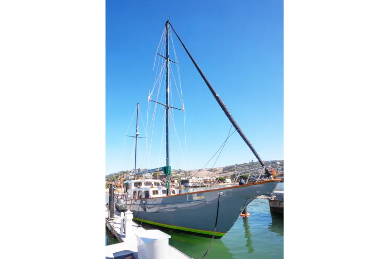 The Image of 1981 Thackwray Motorsailor docked in a sunny marina, showcasing its elegant design. - 0