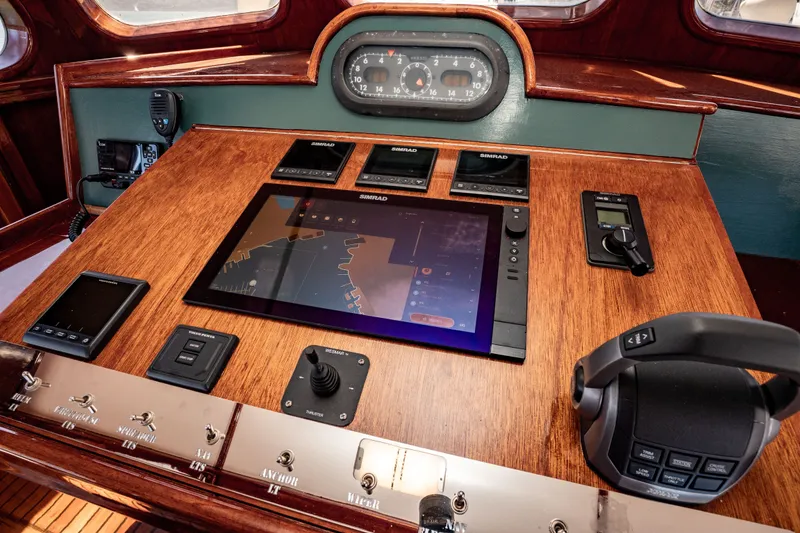 Slide: The Image of Control panel of a 1981 Thackwray Motorsailor with navigation and communication equipment. - 69