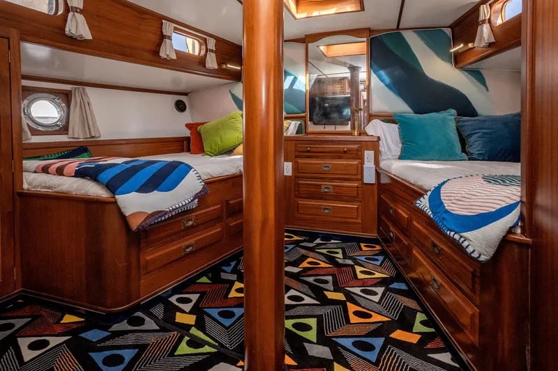 Slide: The Image of Luxurious 1981 Thackwray Motorsailor cabin with vibrant decor and wooden furnishings. - 104