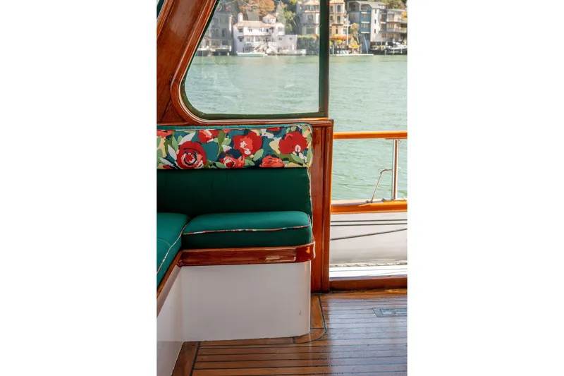Slide: The Image of Interior of 1981 Thackwray Motorsailor with floral cushions and wooden accents. - 52
