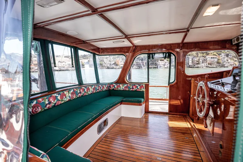 Slide: The Image of Interior of 1981 Thackwray Motorsailor with wooden floors and floral-patterned seating. - 74