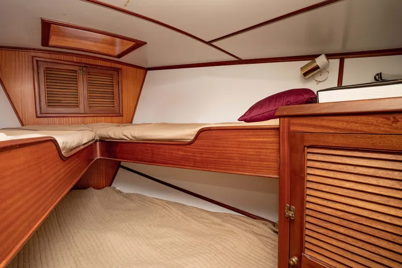 Slide: The Image of Cozy cabin interior of 1981 Thackwray Motorsailor with wooden furnishings and bedding. - 87