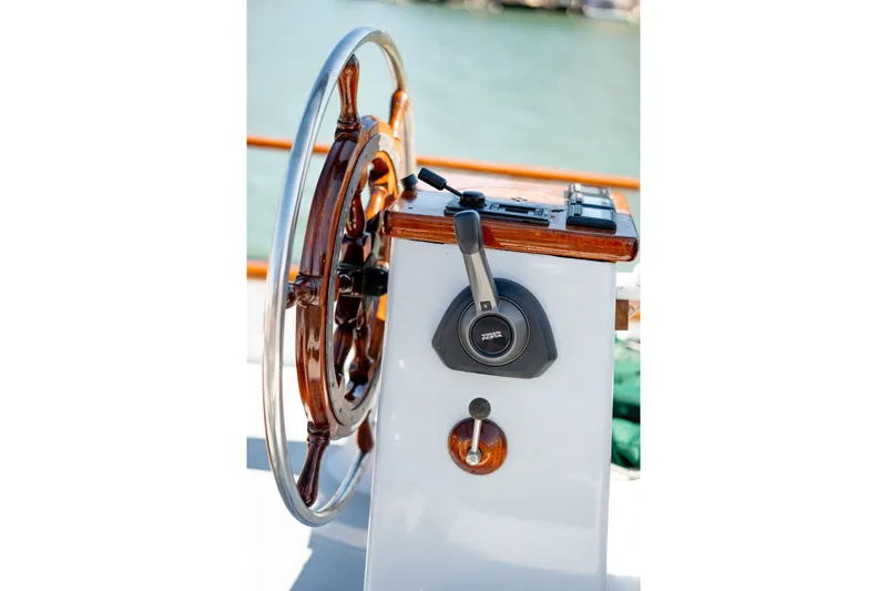 Slide: The Image of Steering wheel and controls of a 1981 Thackwray Motorsailor yacht. - 32