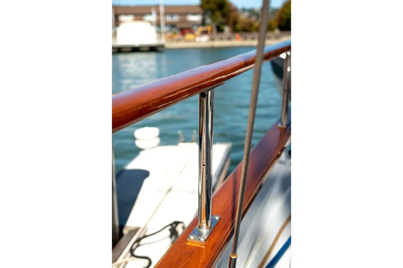 Slide: The Image of Close-up of Thackwray Motorsailor 1981 yacht railing with polished wood and metal details. - 35