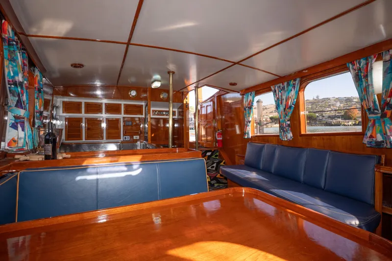 Slide: The Image of Interior of 1981 Thackwray Motorsailor with wooden finishes and colorful curtains. - 119