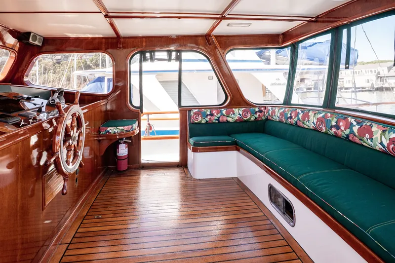 Slide: The Image of Interior of 1981 Thackwray Motorsailor with wooden finish and floral cushioned seating. - 71