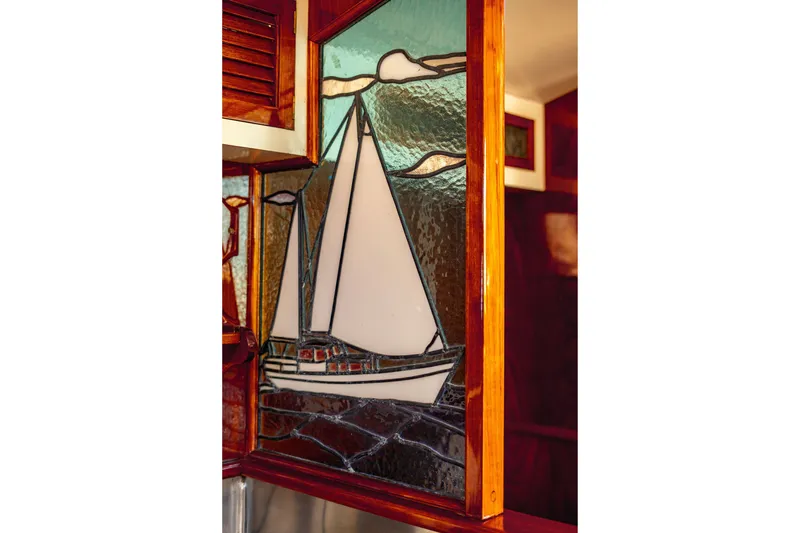 Slide: The Image of Stained glass sailboat design on 1981 Thackwray Motorsailor interior. - 64