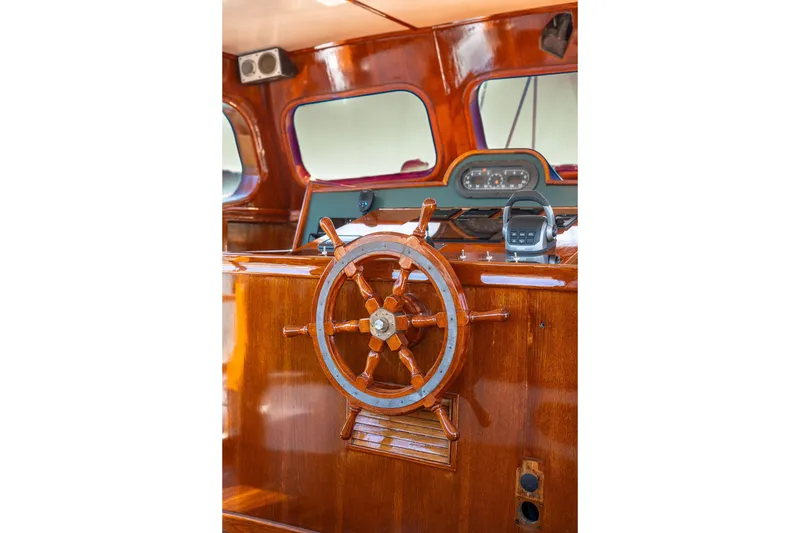 Slide: The Image of Wooden helm of 1981 Thackwray Motorsailor with polished finish and navigation instruments. - 51