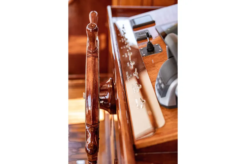 Slide: The Image of Wooden helm and control panel of 1981 Thackwray Motorsailor yacht. - 48