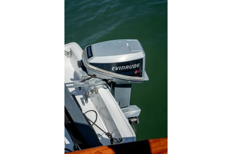 Slide: The Image of Outboard motor on a 1981 Thackwray Motorsailor, floating on calm water. - 27