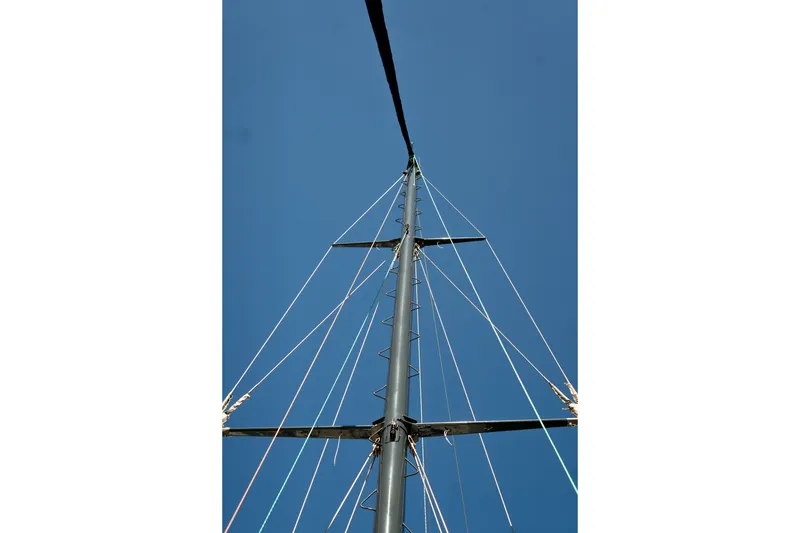 Slide: The Image of Mast of 1981 Thackwray Motorsailor against clear blue sky. - 21