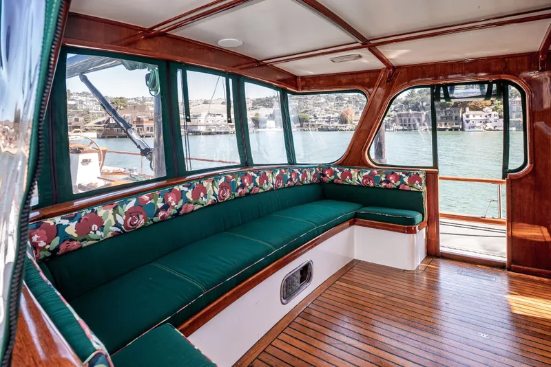 Slide: The Image of Luxurious 1981 Thackwray Motorsailor interior with floral upholstery and scenic waterfront views. - 75