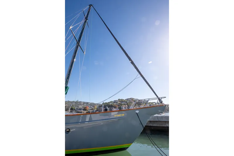 Slide: The Image of 1981 Thackwray Motorsailor yacht docked under clear blue sky. - 16