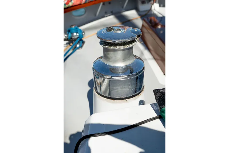Slide: The Image of Winch on 1981 Thackwray Motorsailor deck, reflecting sunlight. - 34
