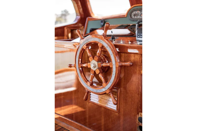 Slide: The Image of Wooden steering wheel on 1981 Thackwray Motorsailor yacht, showcasing polished craftsmanship. - 58