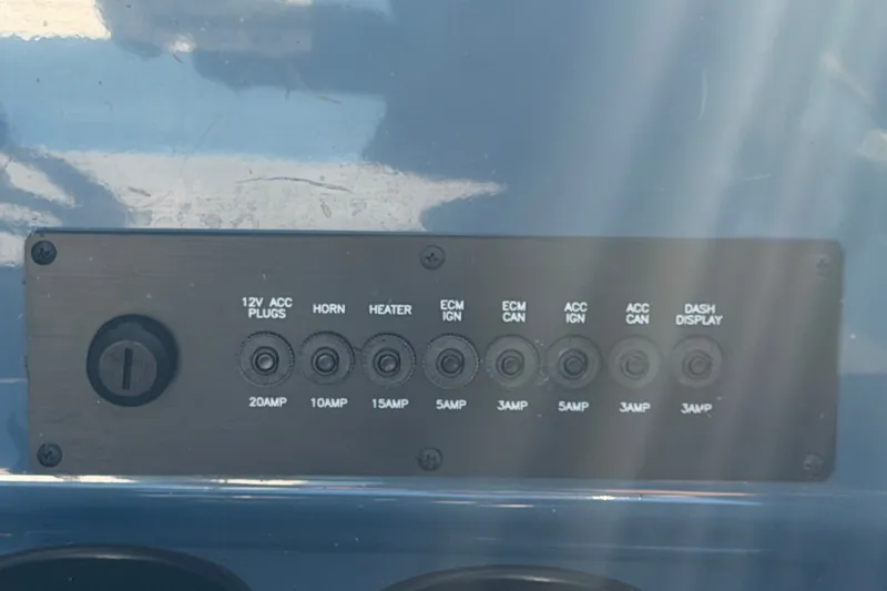 Slide: The Image of Control panel of 2023 Axis T220 boat with labeled switches and amperage ratings. - 40