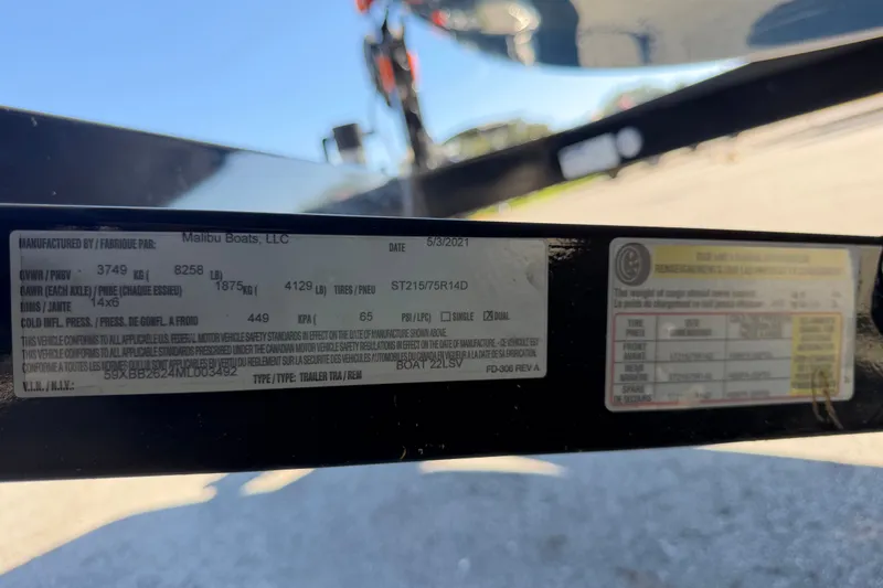 Slide: The Image of Close-up of a 2023 Axis T220 label showing specifications and compliance details. - 80