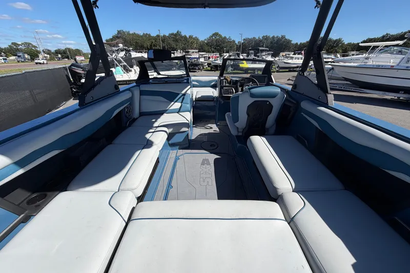 Slide: The Image of Interior of 2023 Axis T220 boat with spacious seating and modern design. - 16