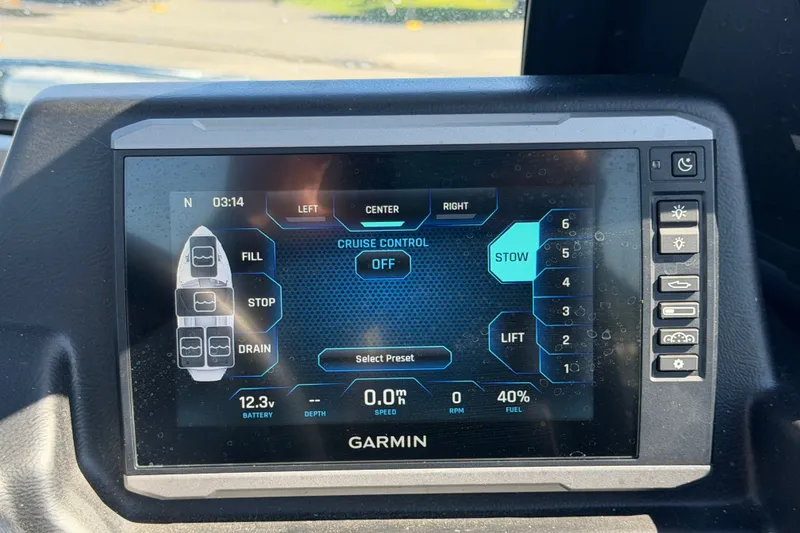 Slide: The Image of Garmin display in 2023 Axis T220 boat showing cruise control and settings. - 35