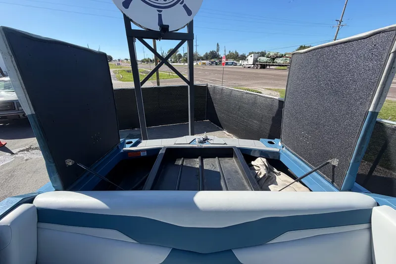 Slide: The Image of 2023 Axis T220 boat interior with open storage compartments. - 67
