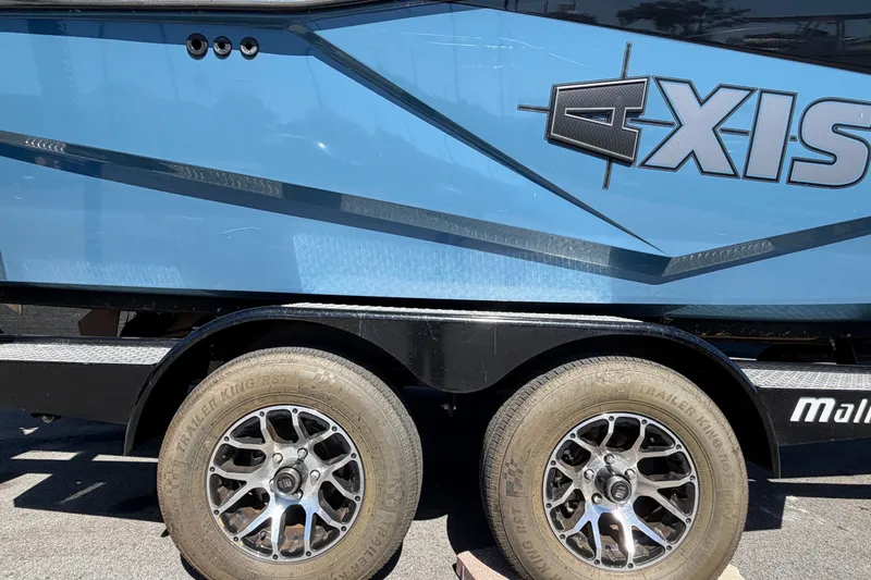 Slide: The Image of 2023 Axis T220 boat trailer with dual wheels and blue exterior design. - 81