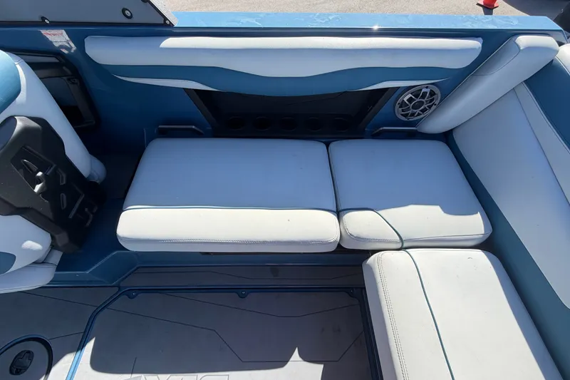 Slide: The Image of Interior seating of 2023 Axis T220 boat with blue and white upholstery. - 60