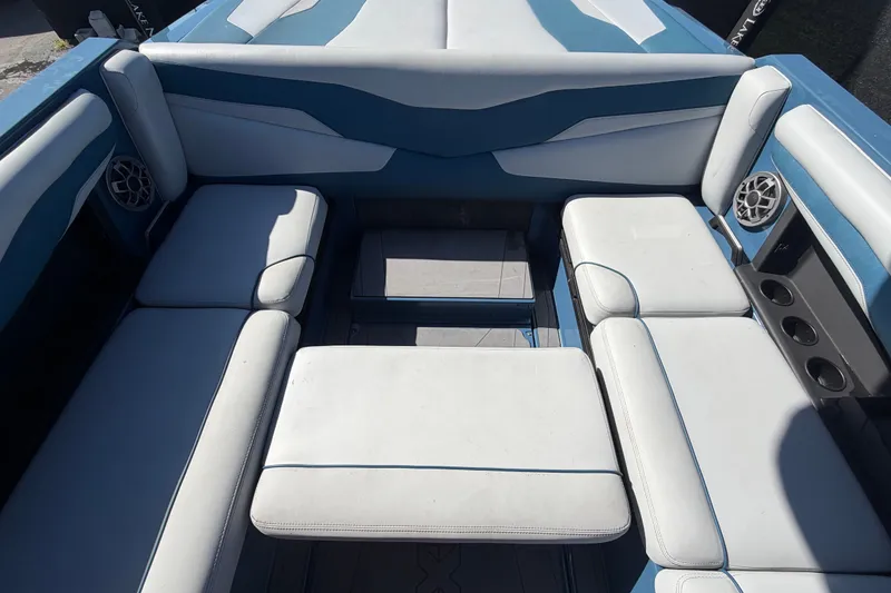 Slide: The Image of Interior seating of 2023 Axis T220 boat with blue and white upholstery. - 63