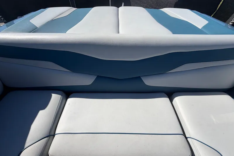 Slide: The Image of 2023 Axis T220 boat interior with blue and white cushioned seating. - 65