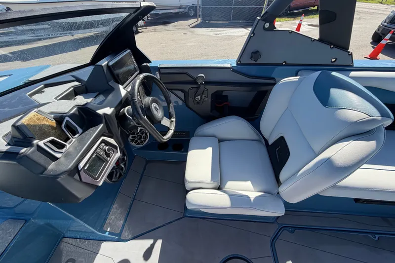 Slide: The Image of 2023 Axis T220 boat interior with modern dashboard and comfortable seating. - 29