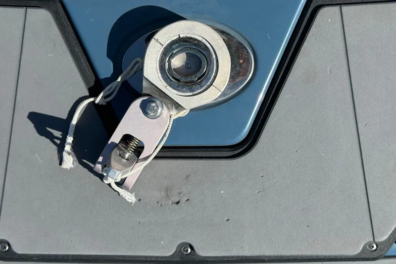 Slide: The Image of Boat latch mechanism on 2023 Axis T220, featuring a metal and rope component. - 75