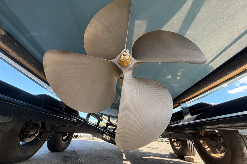 Slide: The Image of Close-up of a 2023 Axis T220 boat propeller under a trailer. - 7