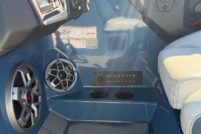 Slide: The Image of Interior of 2023 Axis T220 boat featuring speakers and control panel. - 39