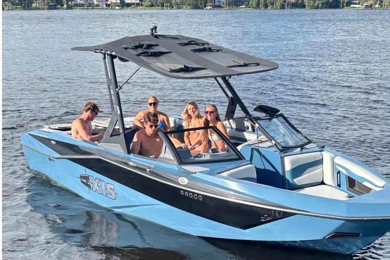 The Image of 2023 Axis T220 boat with passengers on a sunny lake. - 0