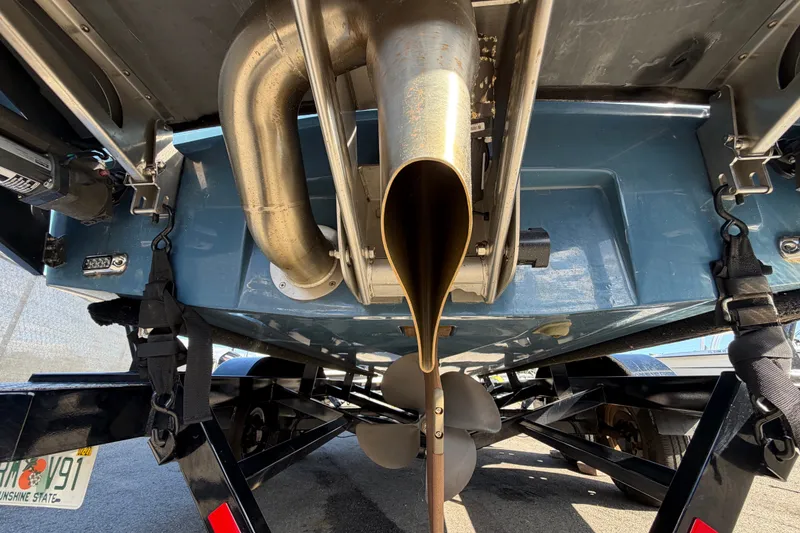 Slide: The Image of Underneath view of a 2023 Axis T220 boat showing exhaust and propeller. - 6