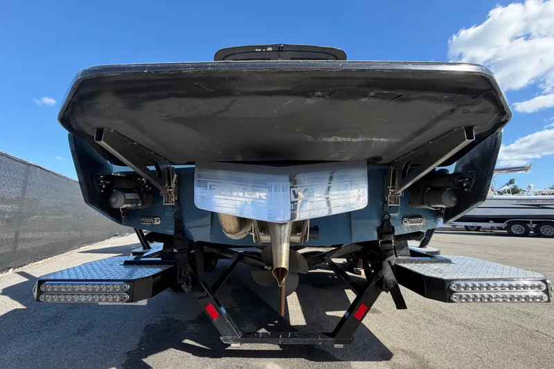 Slide: The Image of Rear view of 2023 Axis T220 boat with dual exhaust and platform. - 5